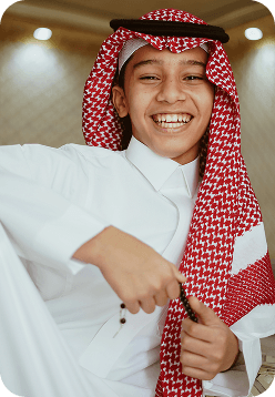 Smiling student in traditional attire