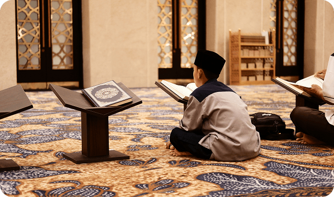 Boy reading Quran